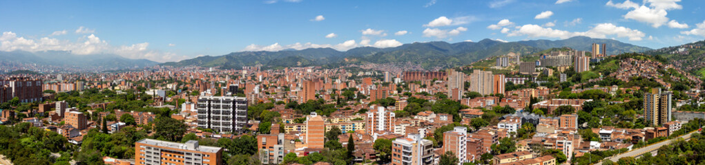 Very wide angle panorama (cityscape) of Medellin on a sunny day, Antioquia, Colombia.