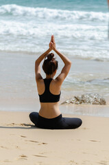 Yoga Meditation woman on the ocean during amazing sunset. Fitness and healthy lifestyle.