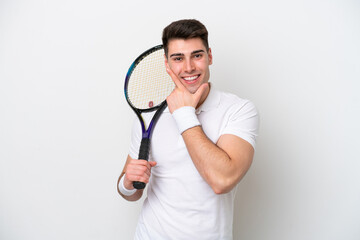 young tennis player man isolated on white background happy and smiling
