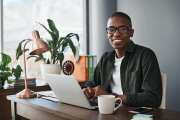 Black, businessman and smile with laptop in portrait for confidence and pride in freelance job....