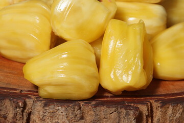 Ripe jackfruit on wooden cutting board