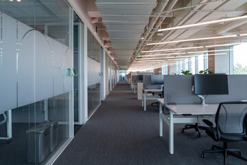 Interior of modern empty office building.Open ceiling design.Equipped with automatic lifting table and LCD screen.