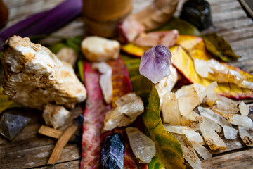 Gemstones and crystals displayed on a plate atop a table
