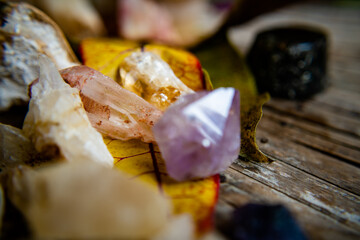Gemstones and crystals displayed on a plate atop a table