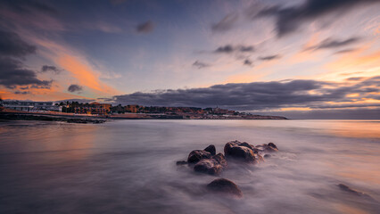 Sunrise seascape photo as a long exposure shot on the island of Fuerteventura