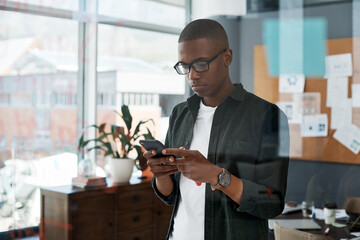 Black man, smartphone and email in office with browsing for communication in business with social...