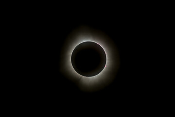 Solar eclipse featuring a diamond ring effect and baileys beads