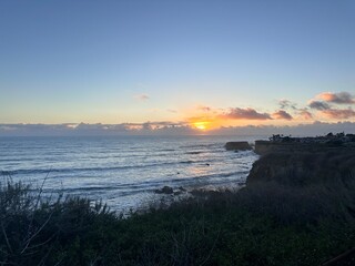 Scenic beach at dusk with a dramatic sky