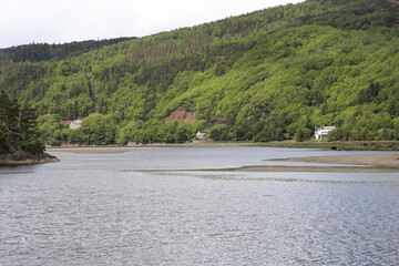 A beautiful view from Penmaenpool down the Mawddach valley towards the sea in Gwynedd, Wales, UK.