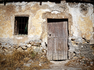 Old rural house with a door and window