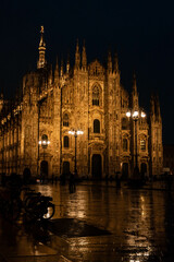 Night view of the grand Milan cathedral with multiple spires