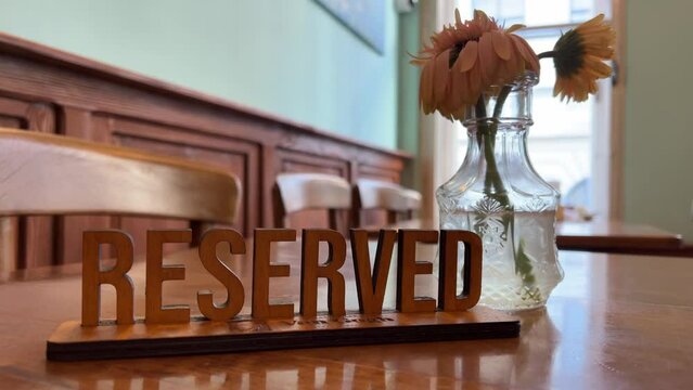 Reserved sign on the table in restaurant. Clouse up. Plate reserved.