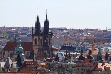Obraz premium Historic town center with ancient buildings and distant spires, Prague
