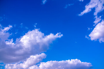 Clouds against the blue sky close-up. Changes in weather during the rainy season. Thunderclouds,...