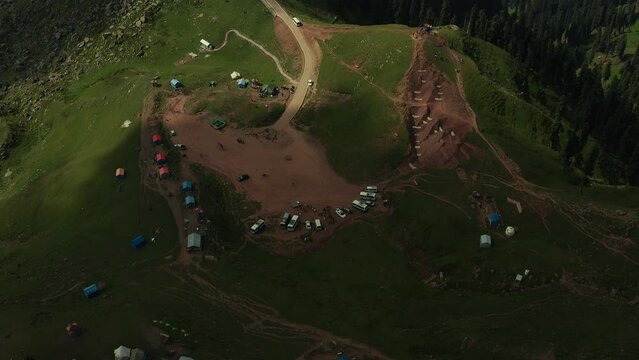 Aerial footage of viewpoint and camp on Ganga Choti peak in Bagh District of Azad Kashmir, Pakistan