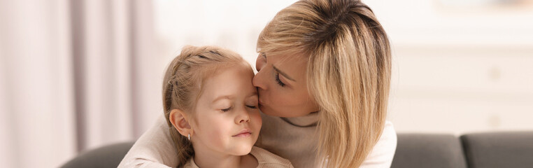 Mother and her little daughter spending time together at home, banner design