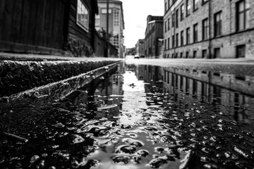 Close up of a puddle on asphalt