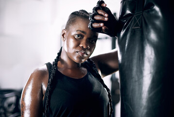 Black woman, portrait and boxing bag for fitness, sweat and confidence for workout. Training,...