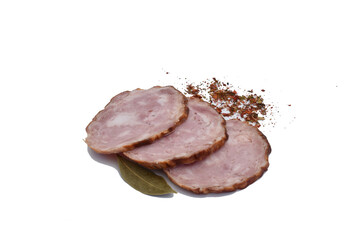 Several slices cut from a large piece of pork.