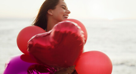 Beach, smile and woman with balloons in heart for love, present and romantic gesture in nature....