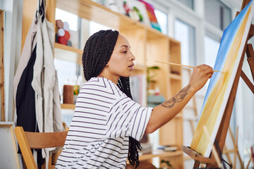 Artist, student and woman painting on canvas or easel for learning, drawing or college project....
