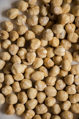 Plate of assorted nuts on a white counter