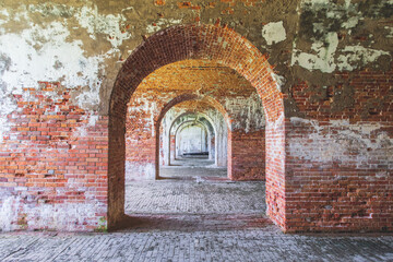 Symmetrical old brick arches form a minimalist geometric composition in fine art style