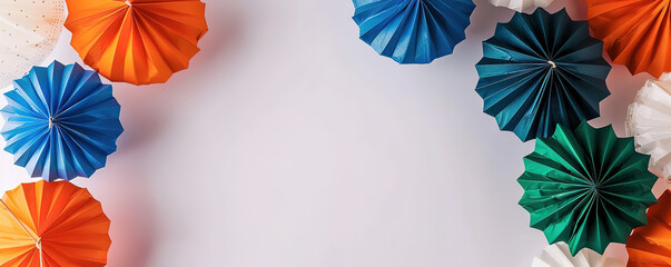 Obraz premium Colorful paper fans in India's flag colors with blank space