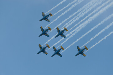 Jet airplane display group performing aerobatic manoeuvrers.