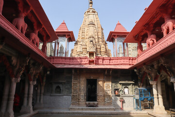 The Interiors of a Digambar Jain temple with eye catching sculpture carvings on the tower and walls...