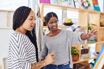Team, woman and art class with discussion for creative, talking students with idea on painting. Female people, communication or strategy for project with color, collaboration with chat on technique