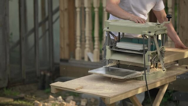 wood processing. woodworking machine. carpenter outdoors. slow motion video. High quality video in FullHD format.