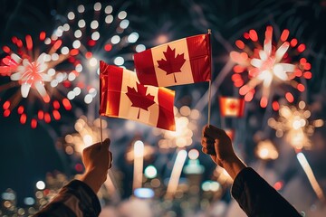 Hands raising Canada flags against festive fireworks at night.