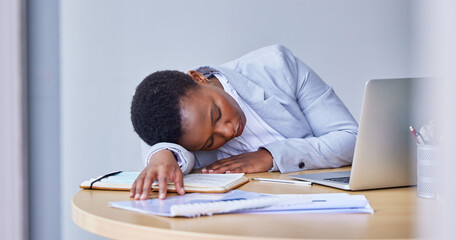Black woman, employee and sleeping with laptop in office with paperwork or documents for research...