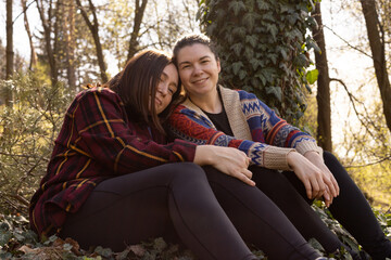 two young women in nature, in the forest