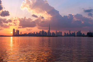 Naklejka premium amazing sunset view of Dubai Downtown cityline from Dubai Creek harbour