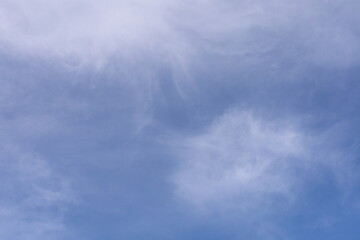 transparent white clouds in the blue sky