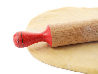 Raw dough and rolling pin isolated on white