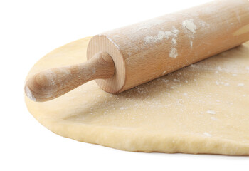 Raw dough and rolling pin isolated on white