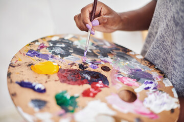 Person, hands and art with palette in closeup for painting project, creative expression and hobby...