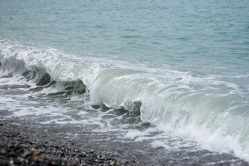 Sea wave crashing on the shore