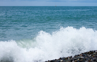 Sea wave crashing on the shore