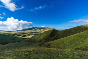 Behold the captivating panoramic view of the expansive grasslands amidst the mountains of Bajura, Nepal during the enchanting autumn season.