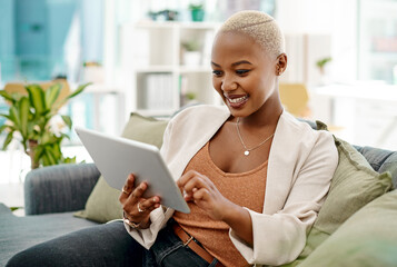 Tablet, black woman and happy on couch for communication, research and success in modern office....