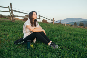 Woman tourist admiring the landscape mountains nature. Tourist traveler on background valley. Hiker...