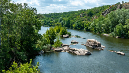 Natural landscape, the bed of the Southern Bug river with granite rifts in the Nikolaev region,...