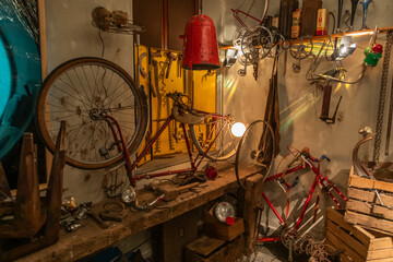 Old bicycle repair shop. Fixing mechanic issues in a garage, maintenance