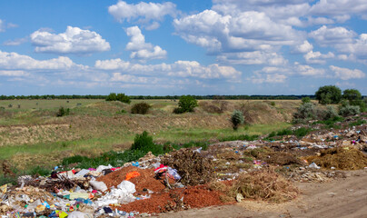 Pollution of nature, spontaneous garbage dump in the field, environmental problem of Ukraine