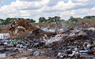 Pollution of nature, spontaneous garbage dump in the field, environmental problem of Ukraine