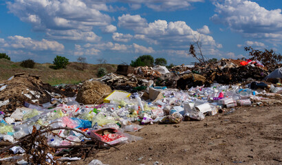 Pollution of nature, spontaneous garbage dump in the field, environmental problem of Ukraine